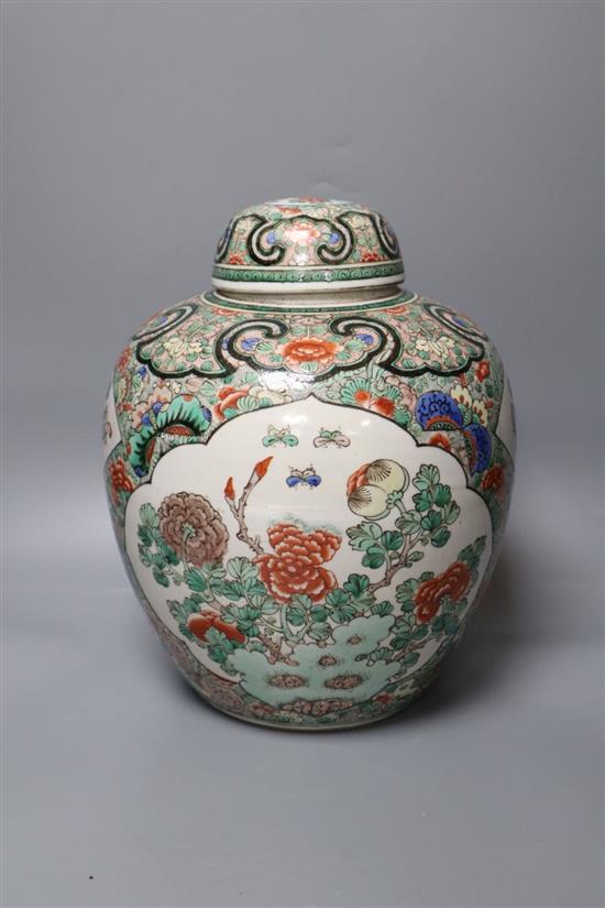 A Chinese famille verte jar and cover, Kangxi mark, 19th century, height 29cm